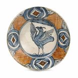 Piatto Faenza, metà del XVI secolo, - Maiolica policroma. Diametro cm 30. Rotto in [...]