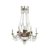 A pair of six-armed chandeliers in gilded bronze and crystals, first half of the 19th [...]