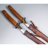 Two 20th Century Oriental katana swords, each with bright steel Damascus blades, leather covered