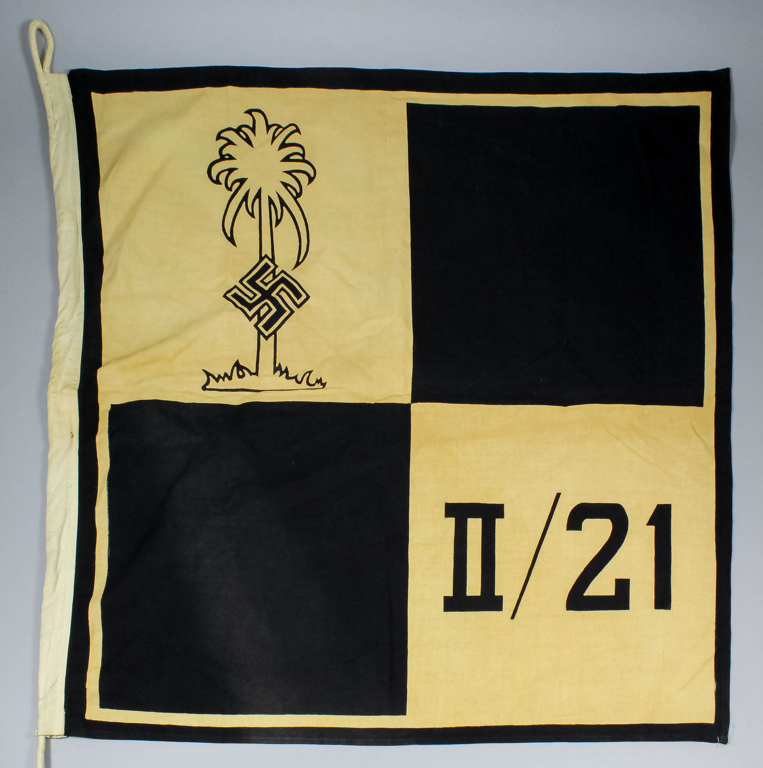 A German World War II Afrika Korps pennant with palm and swastika, II/21, in black and white,
