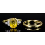 A modern 18ct gold mounted citrine and diamond ring, the central oval cut citrine of approximately