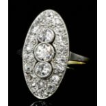 A 1920's 15ct gold mounted all diamond set marquise pattern ring, the central old cut stone of