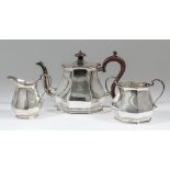 An Elizabeth II silver octagonal three piece tea service of panelled form, comprising - teapot