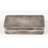 A George IV silver rectangular snuff box with incurved sides, the lid and base with engine turned