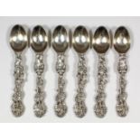 A set of six Victorian silver teaspoons, the handles cast with the "Dutch Teniers" manner, with