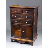 A 19th Century miniature mahogany and parquetry chest of two short and two long drawers over a