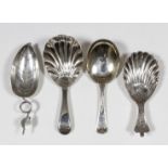 A Georgian silver caddy spoon, the leaf pattern bowl with wriggle-work and with wirework handle,