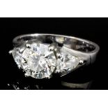 A modern silvery coloured metal mounted diamond solitaire, the brilliant cut stone of