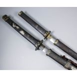 Two 20th Century Oriental katana swords with bright steel Damascus finish blades, steel hilts and