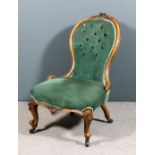 A Victorian walnut framed spoon back nursing chair, the moulded showwood frame with floral cresting,