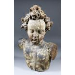 A late 17th Century South German carved limewood bust of a Cherub, with traces of gesso and original