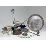 An Indian silvery metal model of a junk, 15ins overall x 11ins high, on blue cloth covered oval