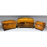 A George III mahogany tea caddy of sarcophagus shape, the whole inlaid with boxwood stringings,