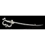 An early 20th Century silvery coloured metal mounted diamond set scimitar pattern brooch, the hilt