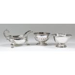 An Elizabeth II silver oval sauce boat with embossed Celtic pattern rim and high scroll handle, on