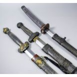 A 20th Century Oriental katana sword 47ins overall and two Chinese broadswords each having