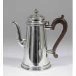 An Elizabeth II silver cylindrical coffee pot of 18th Century design and of tapered form, with