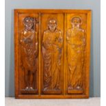 A 19th/20th Century oak panel carved with three apostles, 45.25ins x 37.25ins