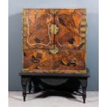 A Japanese parquetry cabinet on ebonised stand, the cabinet with parquetry top, sides, interior