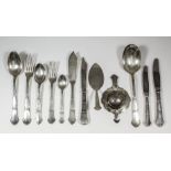 A Danish silver table service with hammered finish and moulded handles by Christian F. Heise,