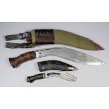 A 20th Century Indian Army Kukri, the 12ins blade bearing armourers mark, green canvas covered