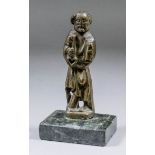 An early bronze figure of St Peter holding book and key, 4.75ins high, on polished green marble