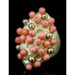 A modern Tamara 18ct gold coral set ring, the marquise shaped panel set with coral and gold beads to