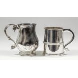 A George V silver tankard, the plain bulbous body with cut-card ornament to the lower body and