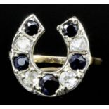 A late Victorian gold and silvery coloured metal mounted sapphire and diamond set horseshoe