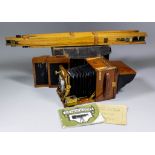 An early 20th Century "Sanderson" mahogany and brass half plate camera in leather case, with