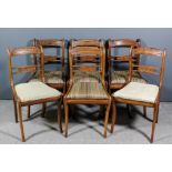 A set of six George IV rosewood dining chairs, the narrow panelled crest rails with carved gadroon