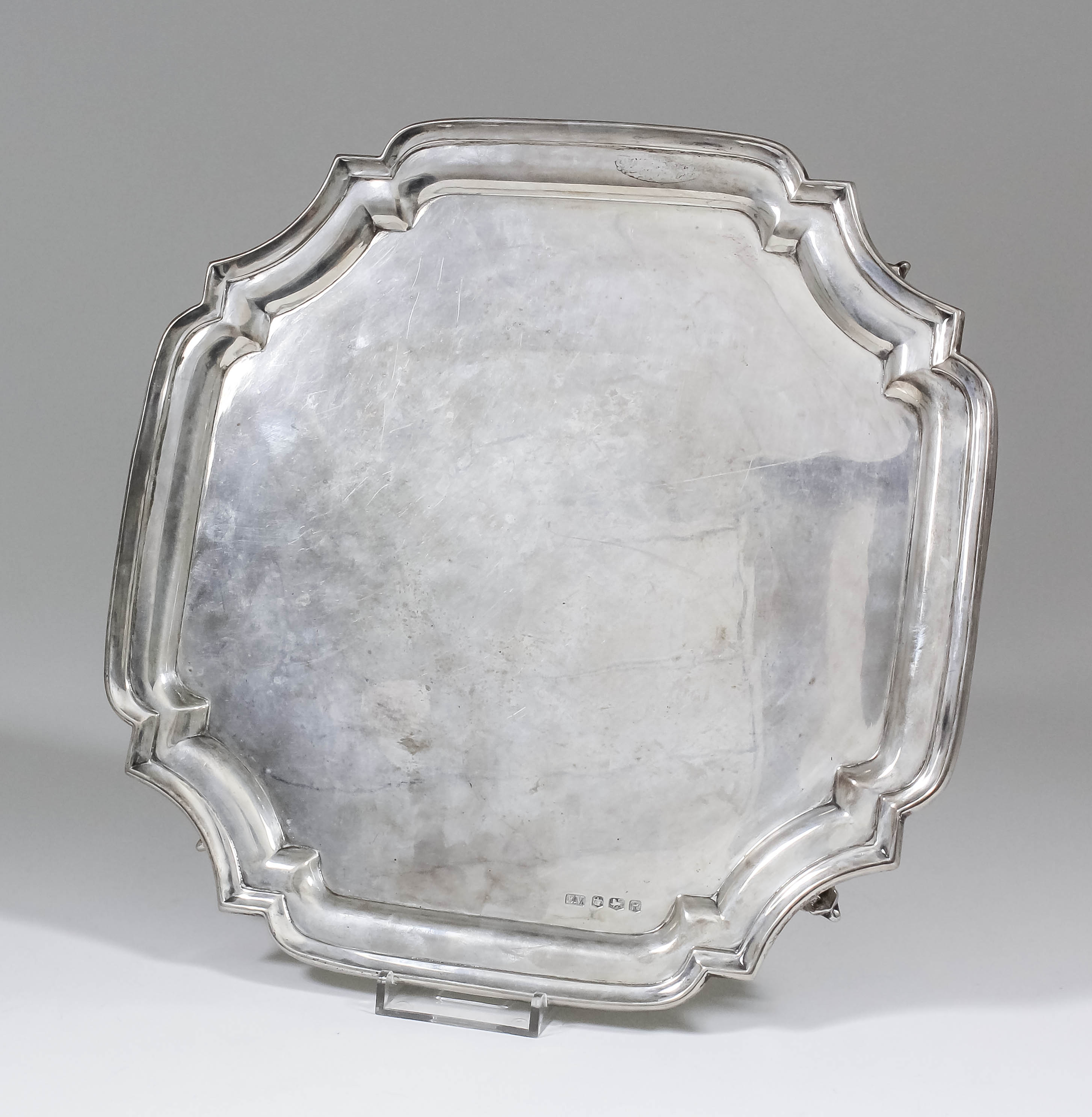 An Elizabeth II square salver of "18th Century" design, with moulded edge and re-entrant corners, on
