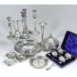 A set of four Edward VII silver rectangular salts with reeded and scroll mounts and part reeded