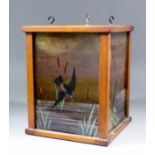 An early 20th Century oak framed hall lantern inset with glass panels painted with kingfishers