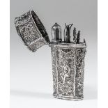 An 18th Century Continental silvery metal etui of oval tapered and panelled form, the whole embossed