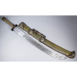 A 20th Century Chinese ceremonial sword, the 29ins blade heavily decorated with a dragon and