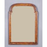 An 18th Century walnut framed rectangular wall mirror with shaped and moulded frame and inset with