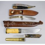 A good 20th Century Sheffield sheath knife 10ins overall, two other sheath knives and one folding