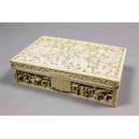 A Chinese Cantonese ivory rectangular box, the sides and top pierced and carved with figures in