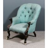 A Victorian mahogany framed spoon back easy armchair upholstered in blue cloth, the back buttoned,