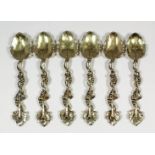A set of six George III silver gilt teaspoons, the handles cast with fruiting vines and with leaf