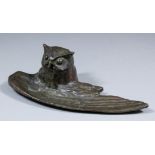 An early 20th Century bronze "Owl" inkwell, the bird's wing outstretched to form a penholder, 2.5ins