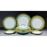 An Aynsley bone china green and gilt part dinner service, comprising - ten 10.75ins dinner plates,