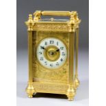 A late 19th/early 20th Century French carriage clock, the 2.25ins diameter cream enamel chapter ring