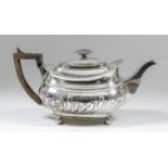 A George III silver rectangular tea pot with gadroon mounts, part reeded and fluted bulbous body, on