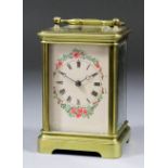 A late 19th/early 20th Century French carriage clock, the cream painted 1.875ins diameter dial