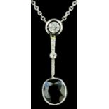 A modern 18ct white gold mounted sapphire and diamond pendant, the oval cut sapphire of