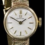 A 1960's lady's Omega 9ct gold cased wristwatch, the circular white dial with baton numerals, in