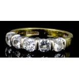 A modern 18ct white and yellow gold mounted five stone diamond ring, the brilliant cut stones each