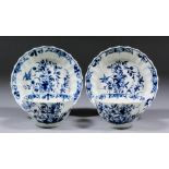 Two Worcester blue and white porcelain tea bowls and saucers with fluted sides, decorated with "